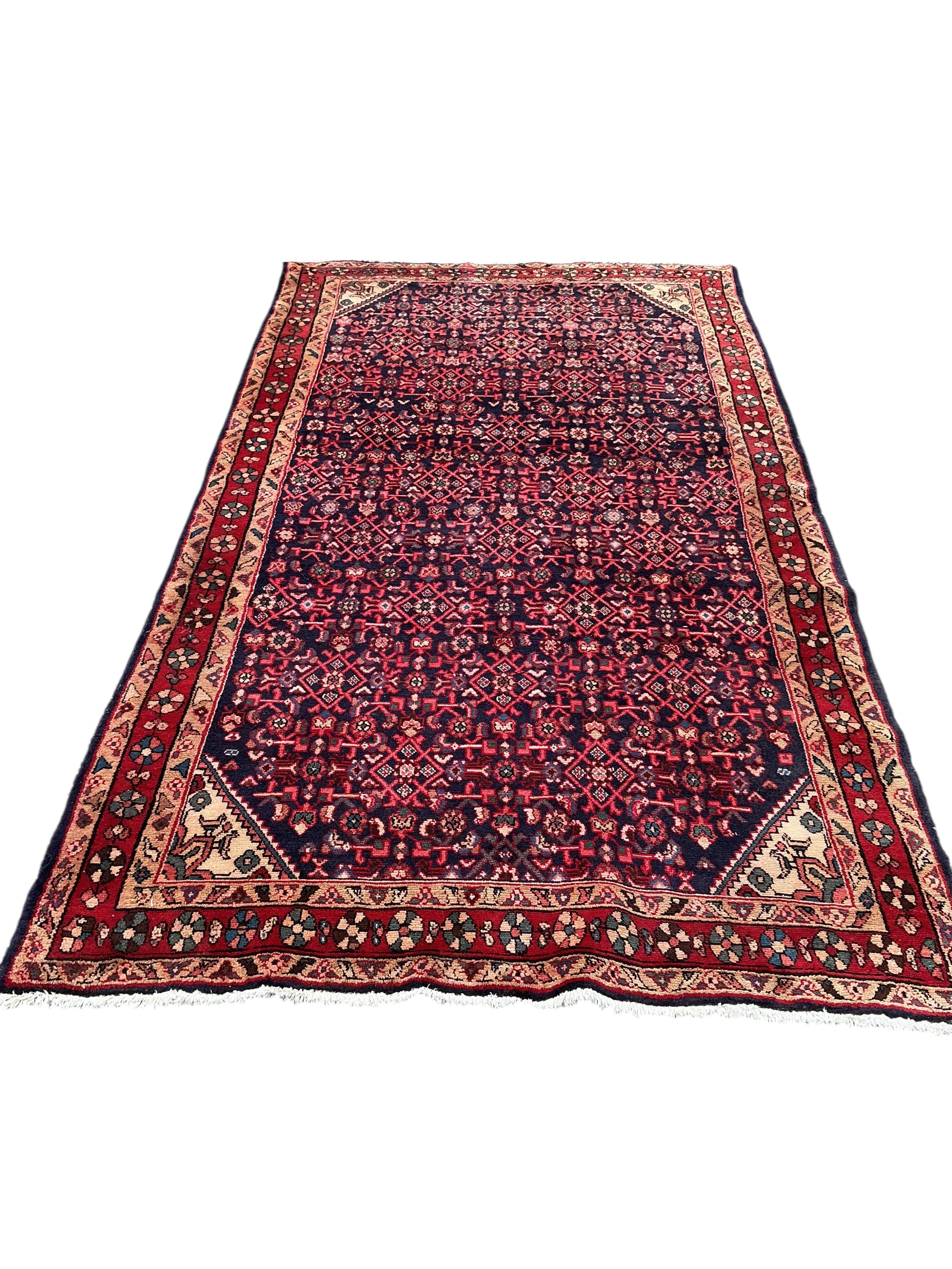 A Hamadan red ground carpet, 282 x 159cm